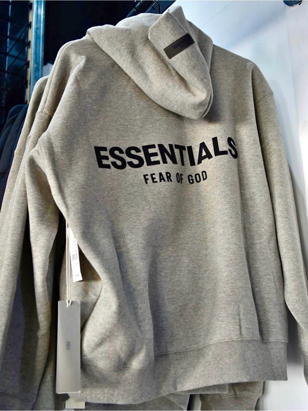 Fear of God Essentials Hoodie in Heather Gray with Black Logo
